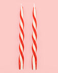 A red and white twist taper candle set of two. 