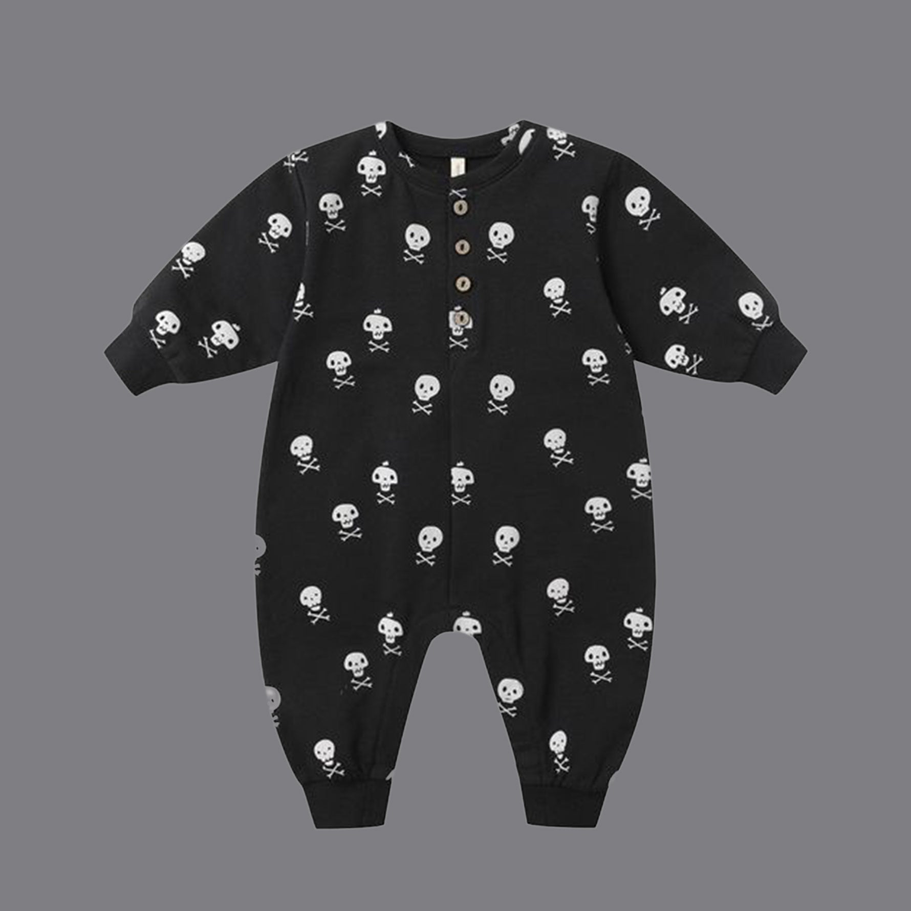 Black long sleeve jumpsuit for kids with a skull and crossbones print. 