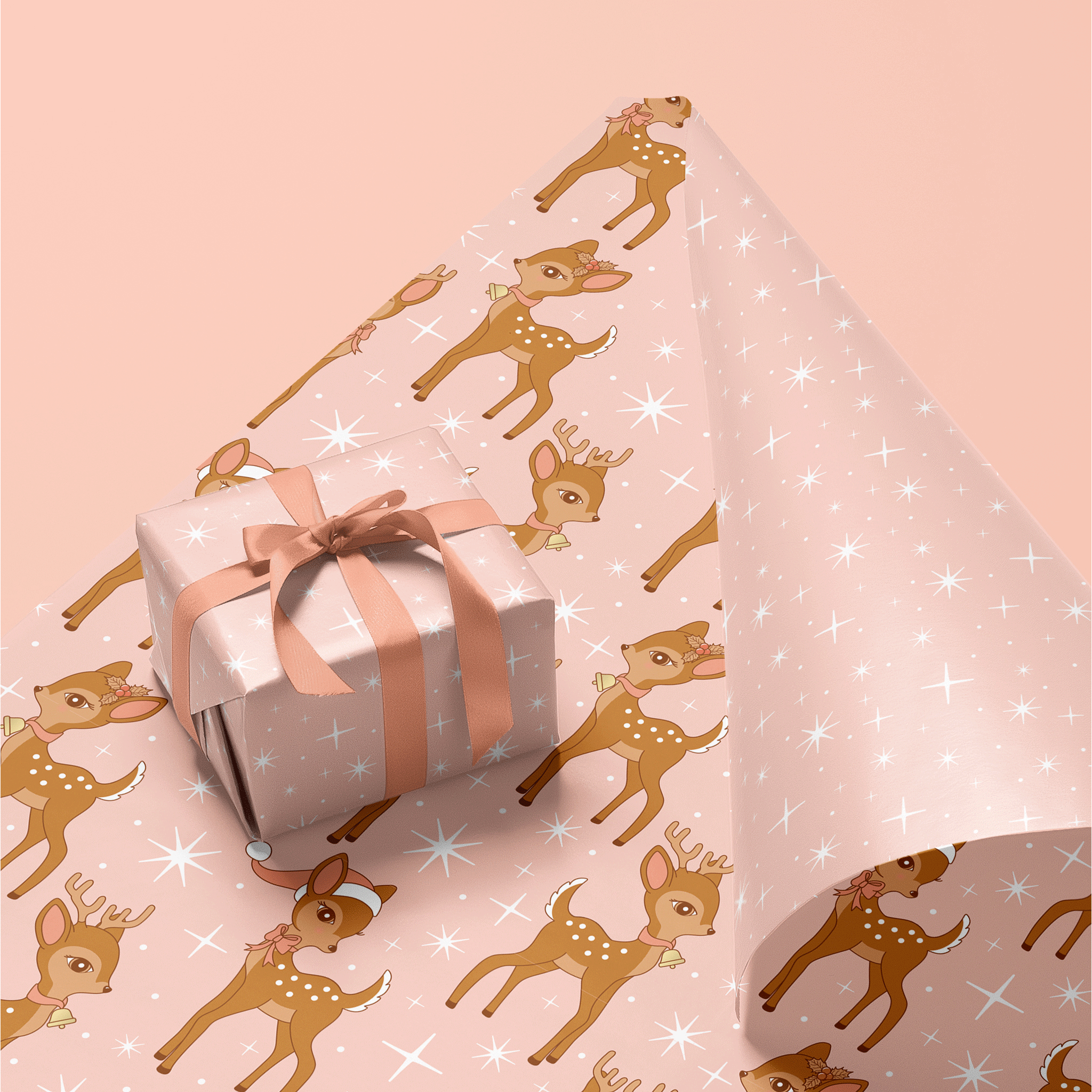 On a pink background is a pink and white sparkle gift wrap with a brown retro deer pattern. 
