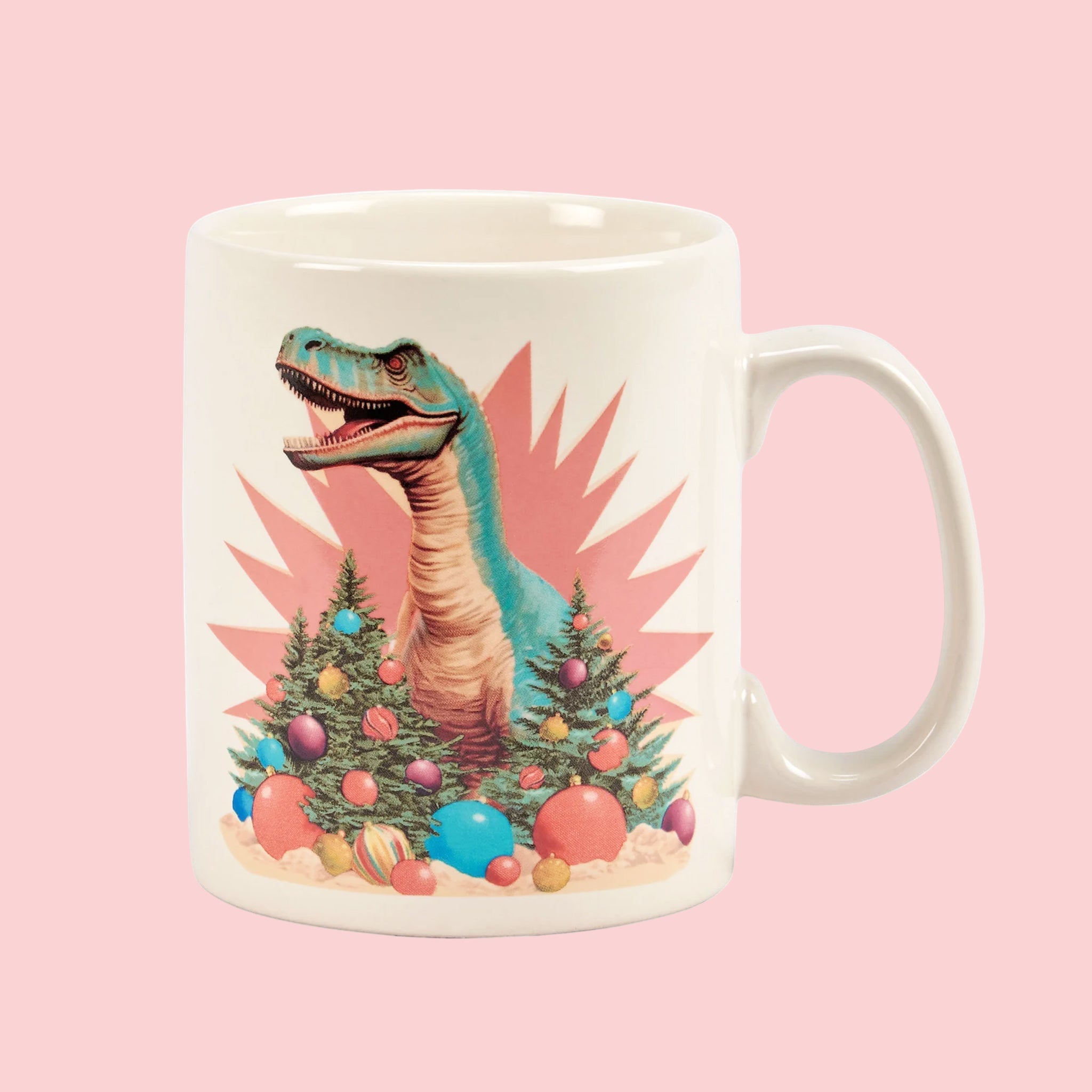 A ceramic mug with a graphic of a dinosaur surrounded by retro holiday trees and decor. 