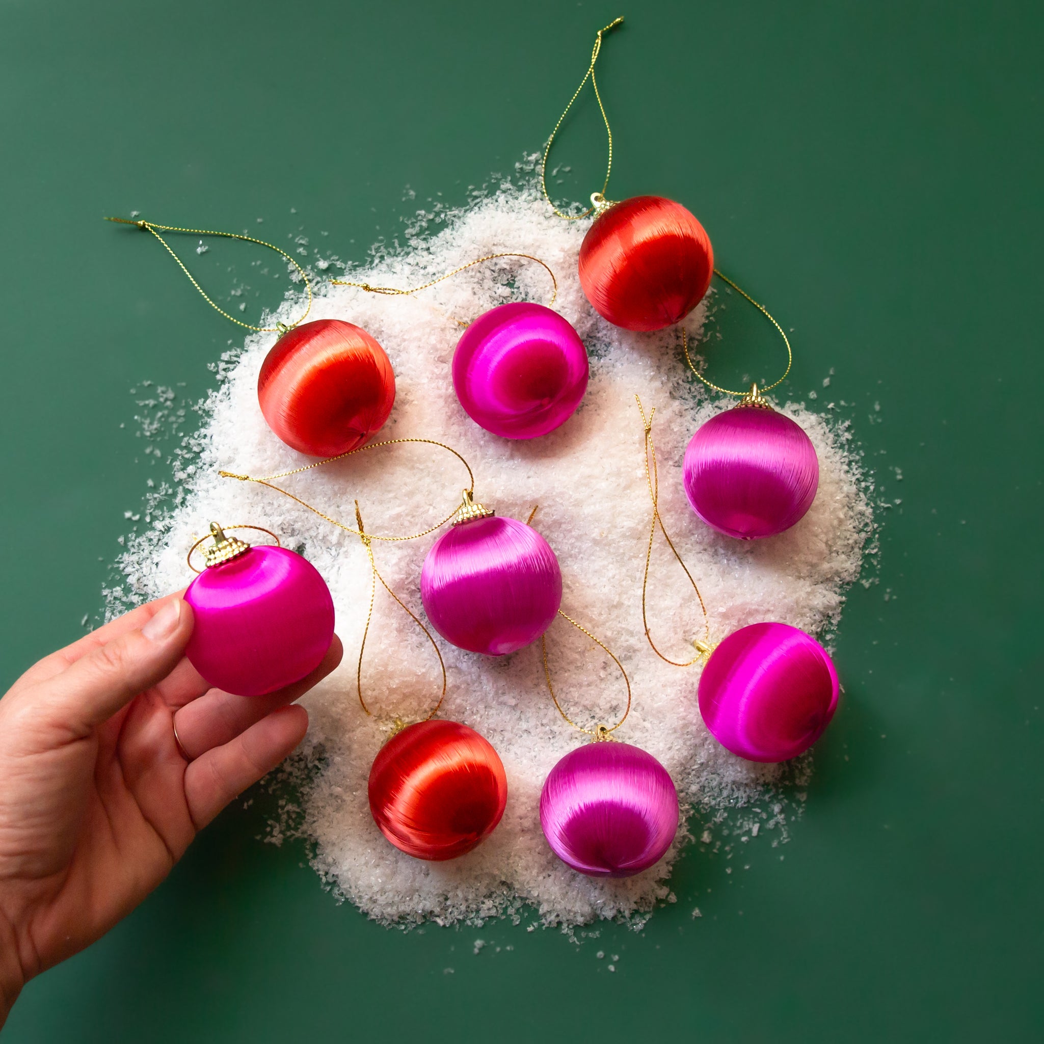 Satin and gold pink and orange ornaments. 