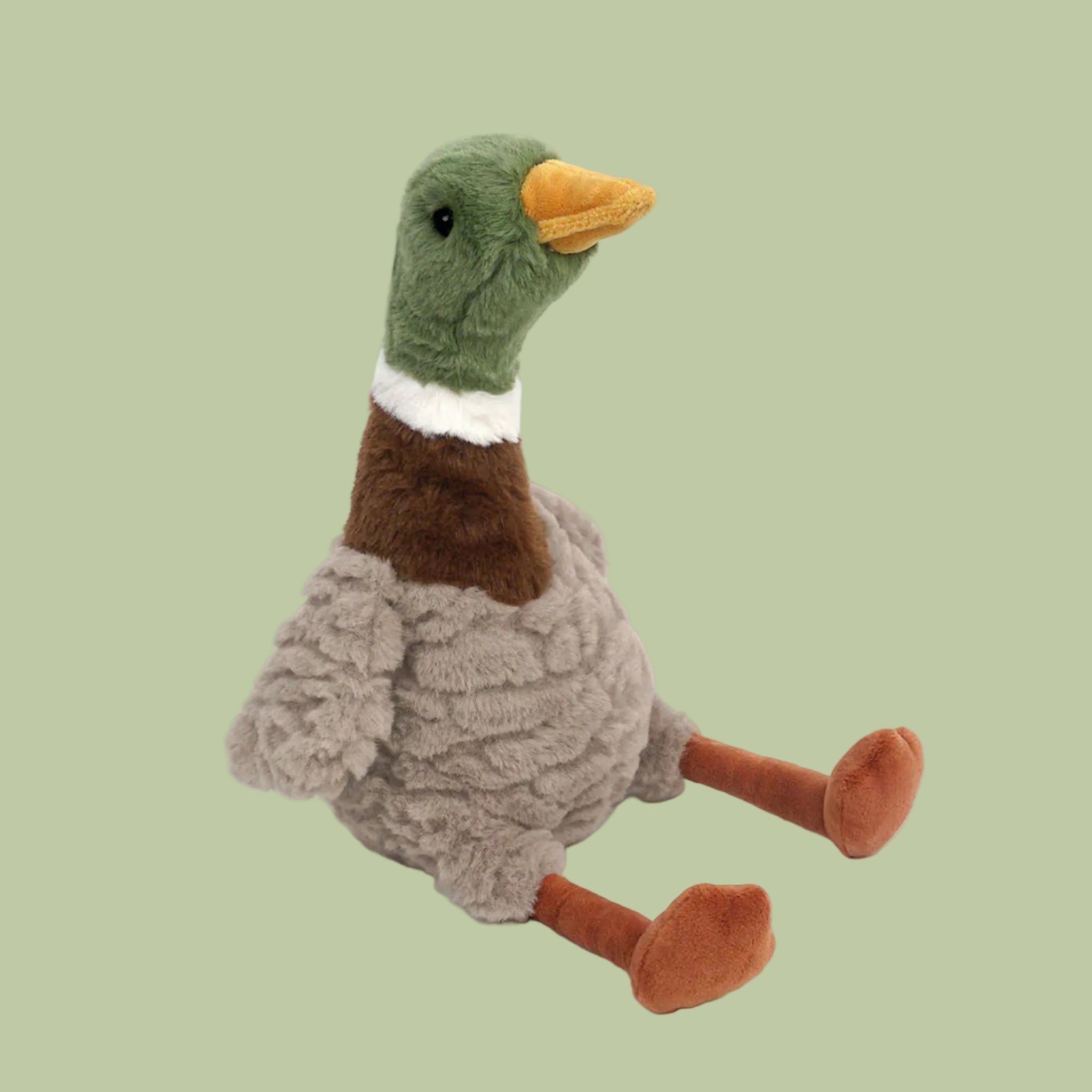 A duck shaped stuffed animal. 