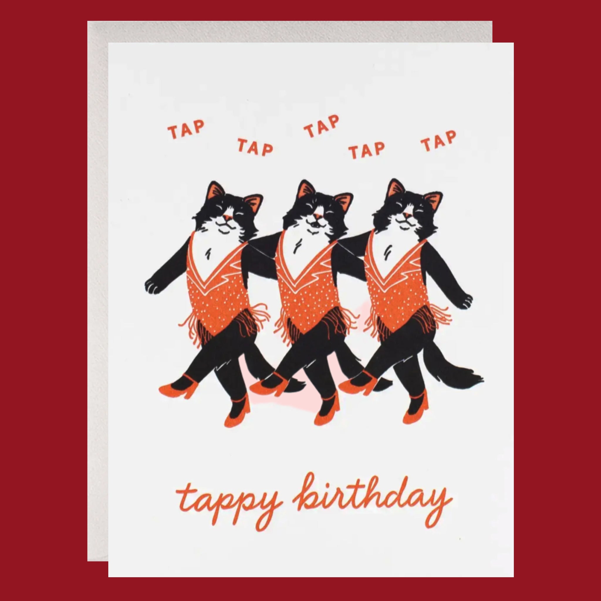 Greeting card with three cats in tap shoes and orange vests on a white background.