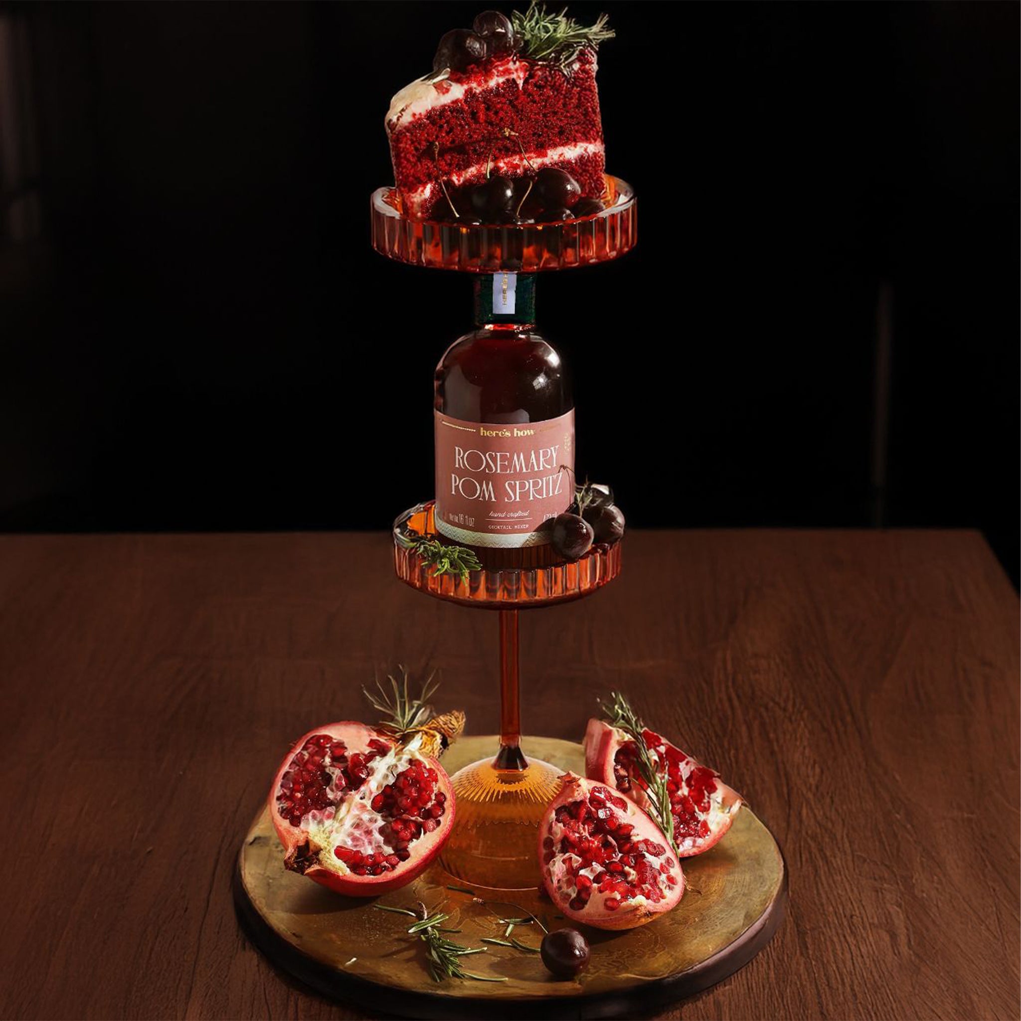 A bottle of cocktail mix with a label that reads, 'Rosemary Pom Spritz'. 