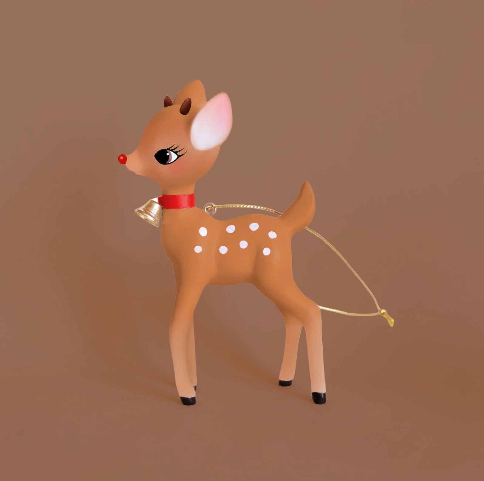 A retro deer shaped ornament with a red nose on a brown background.