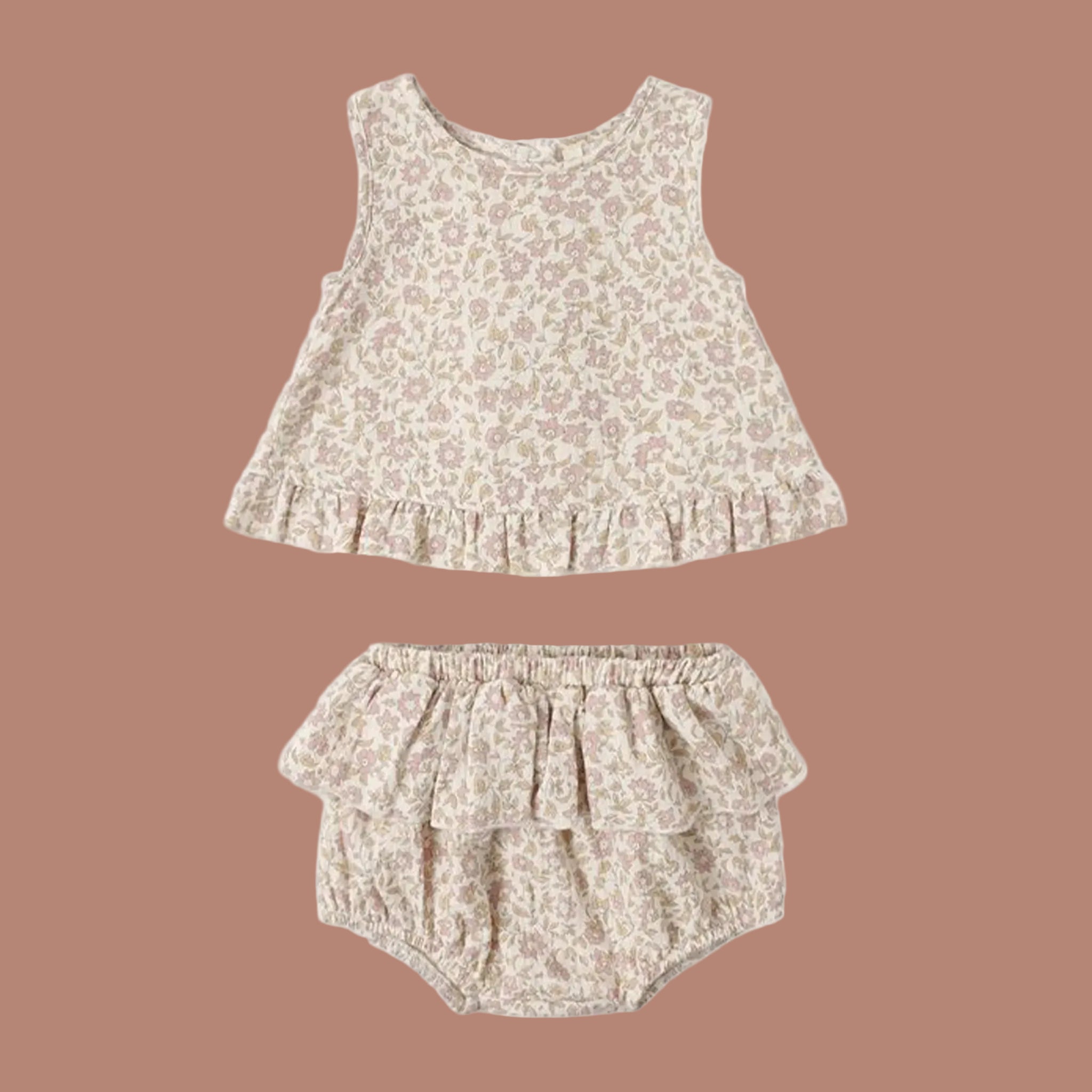A cream and light pink tulip patterned two piece top and bloomer set for babies. 