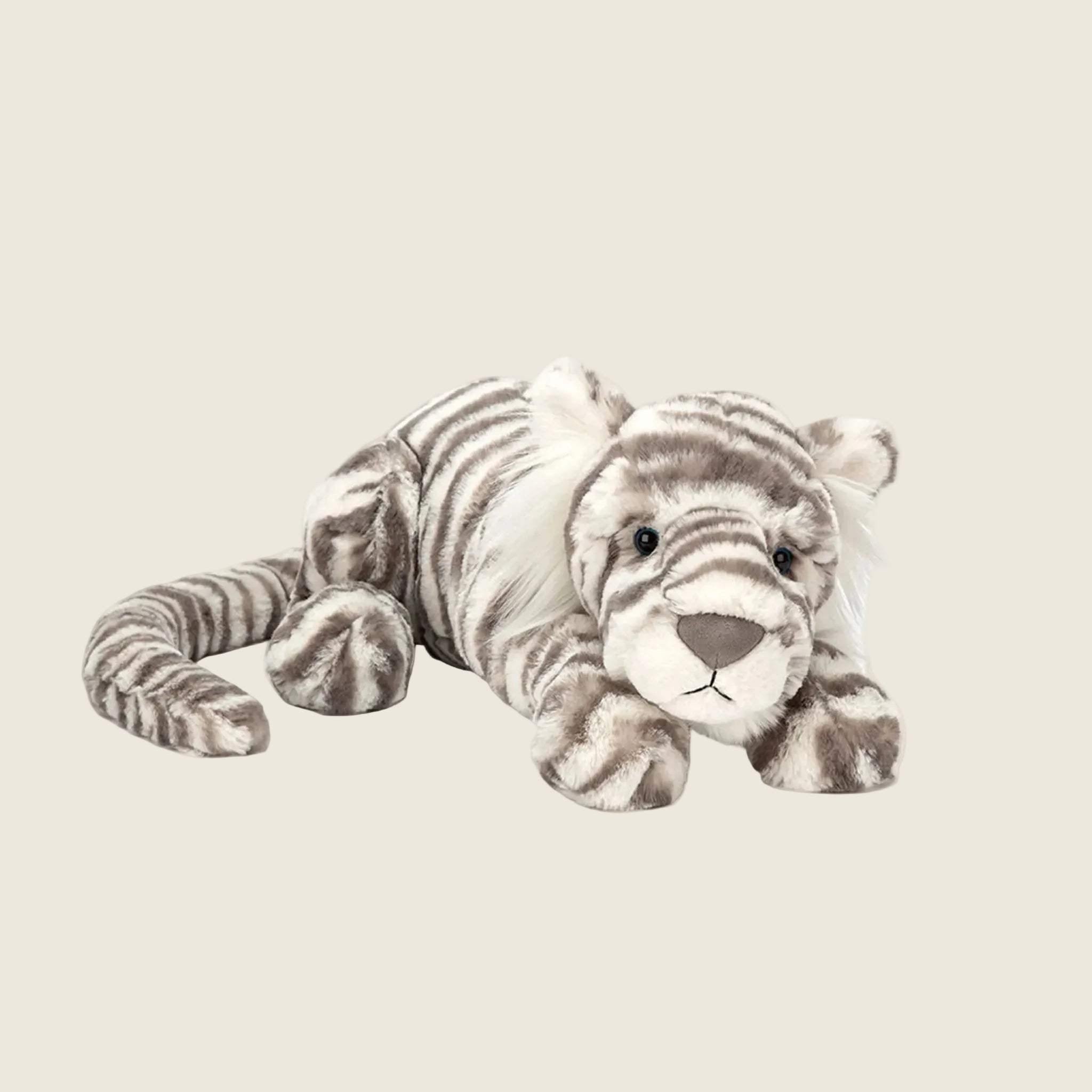 A grey and white striped tiger shaped stuffed toy. 