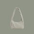 small striped bag with sage colored stripes on a sage colored background.