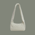 A sage striped nylon shoulder bag with long shoulder strap on a sage colored background.
