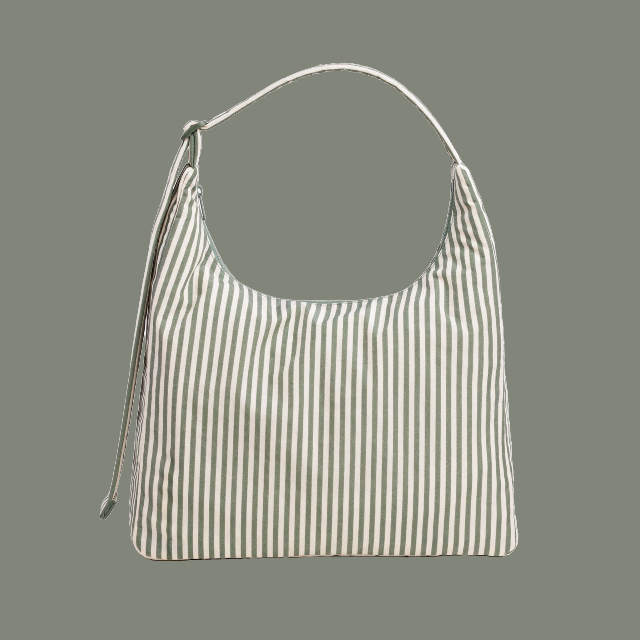 A sage striped nylon shoulder bag on a sage colored ground. 
