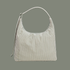 A sage striped nylon shoulder bag on a sage colored ground. 