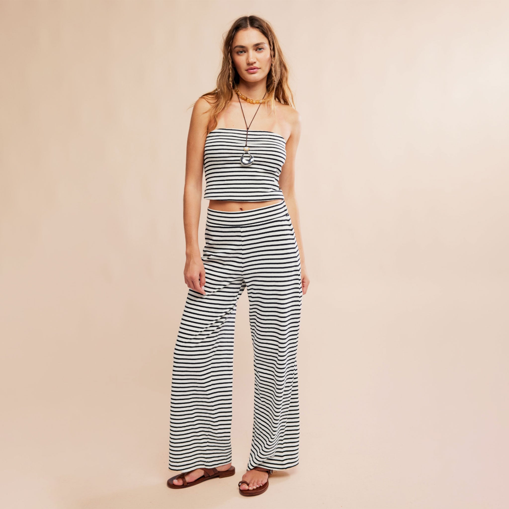 A black and white striped tube top and lounge pant set. 