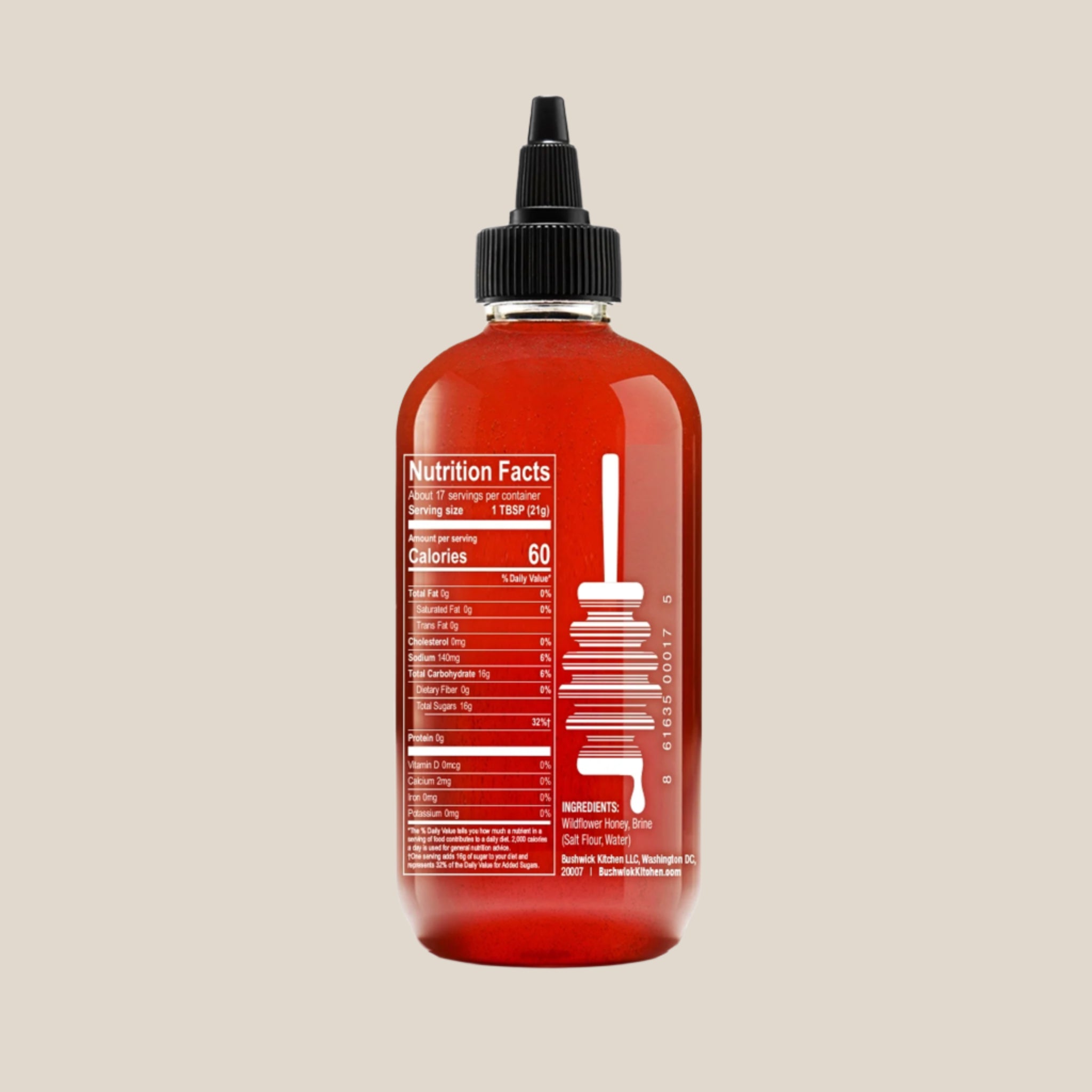 A squeeze bottle of honey with text on the front that reads, &#39;Bees Knees Salted Honey&#39;. 