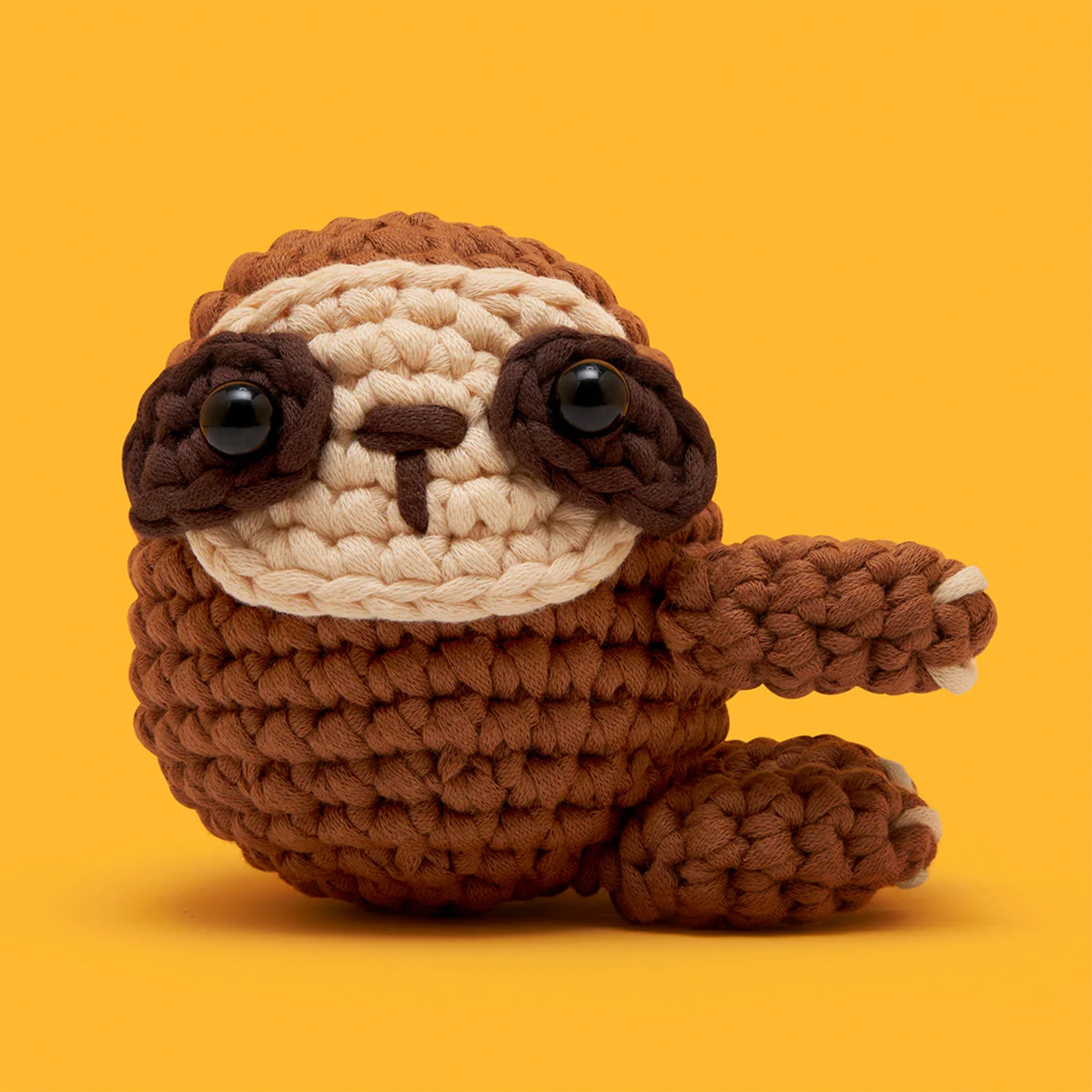 A crochet kit that makes a sloth. 