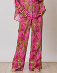 A pink cheetah print satin pajama pant.