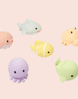 Six multi colored sea creature shaped splash toys. 