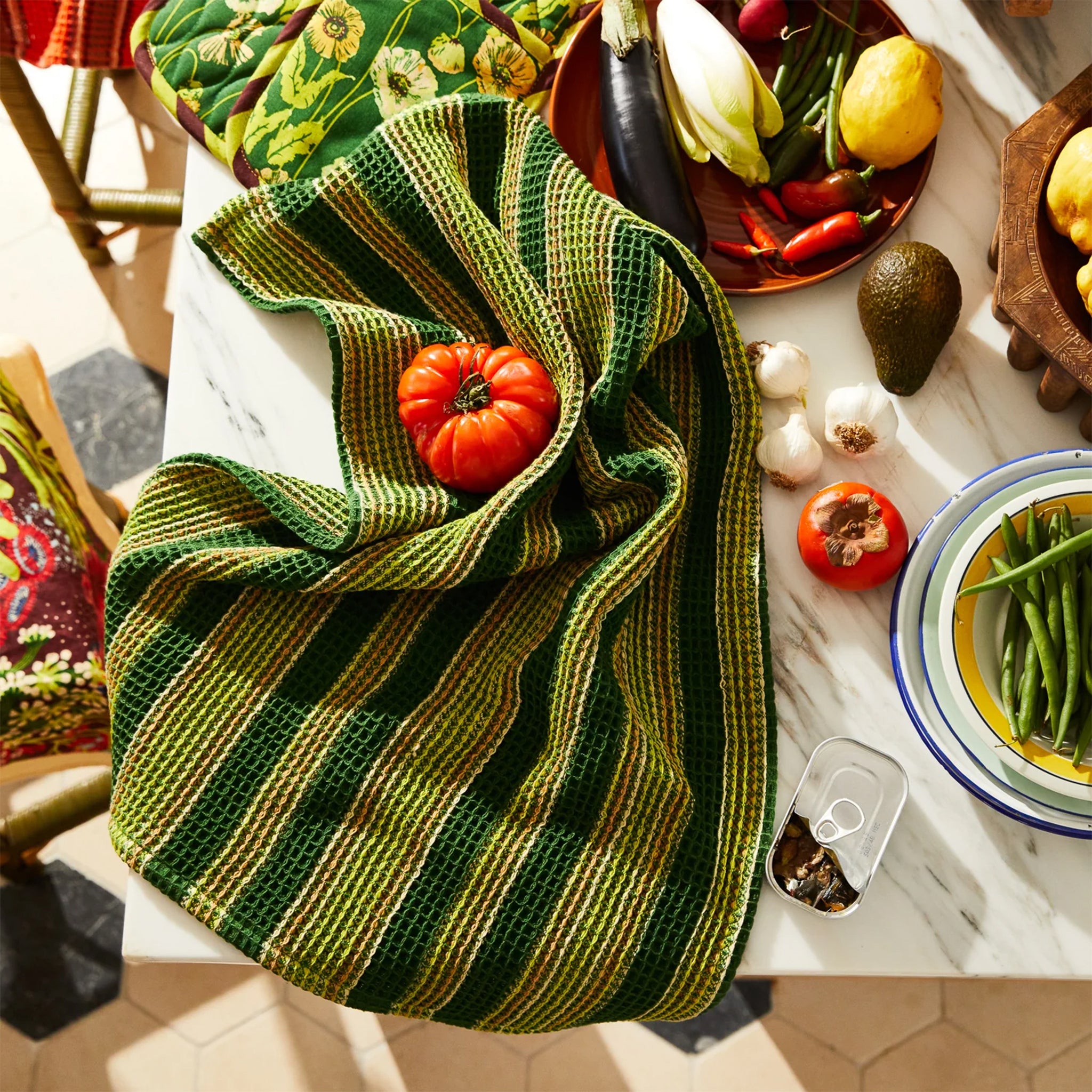 A green striped waffle knit tea towel. 
