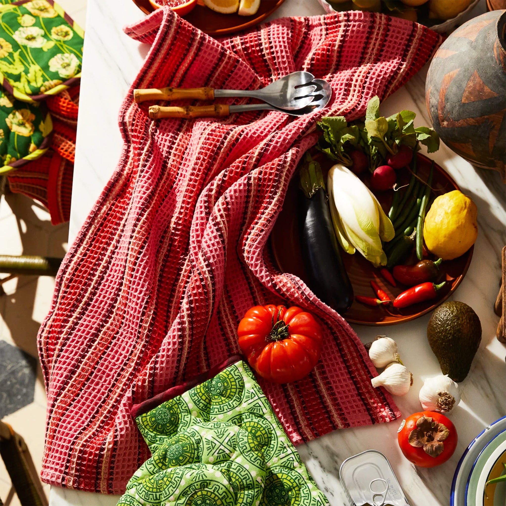 A coral striped waffle knit tea towel. 