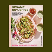 A light pink book with a salad photograph and the title that reads, 'Sesame, Soy, Spice 90 Asian-ish vegan and gluten-free recipes to reconnect, root and restore'. 