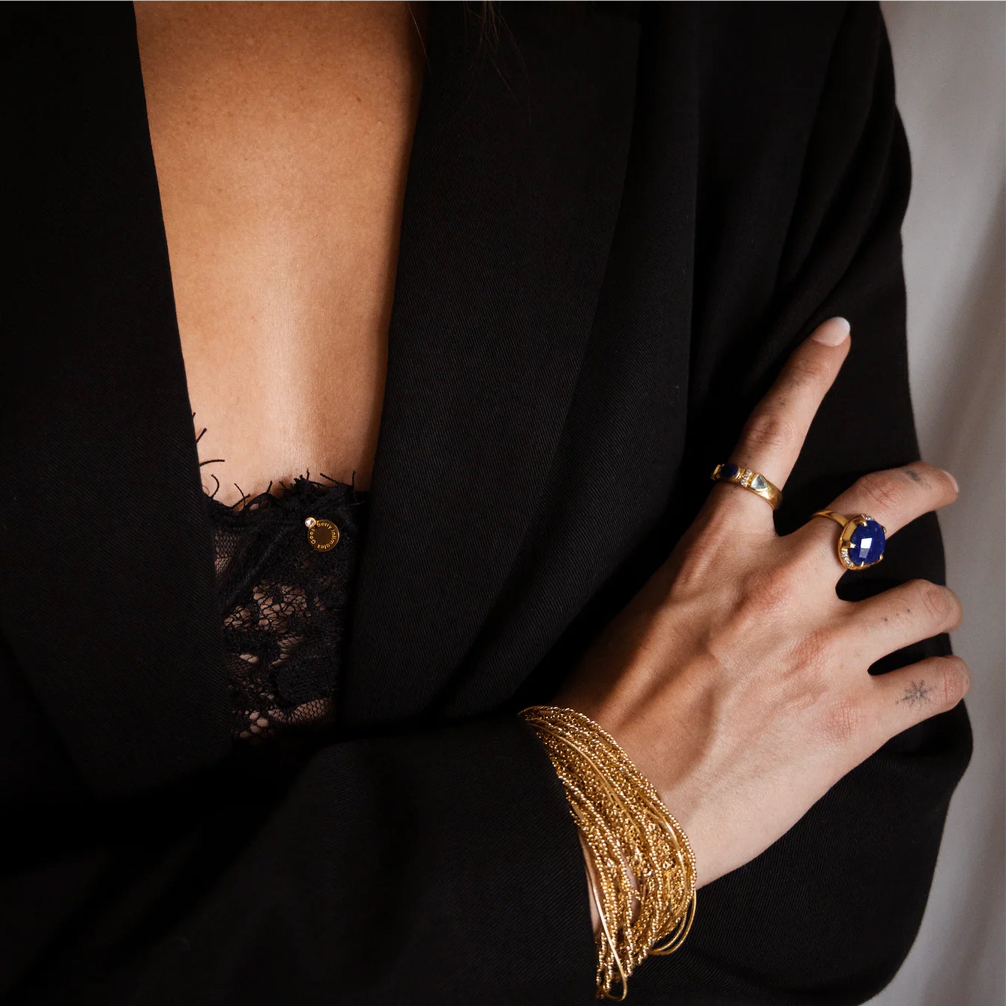 Small thin chains made into one thick bracelet with a conjoining clasp. 