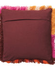 The back of the pillow that features a slip for the insert along with a patternless brown colored fabric. 