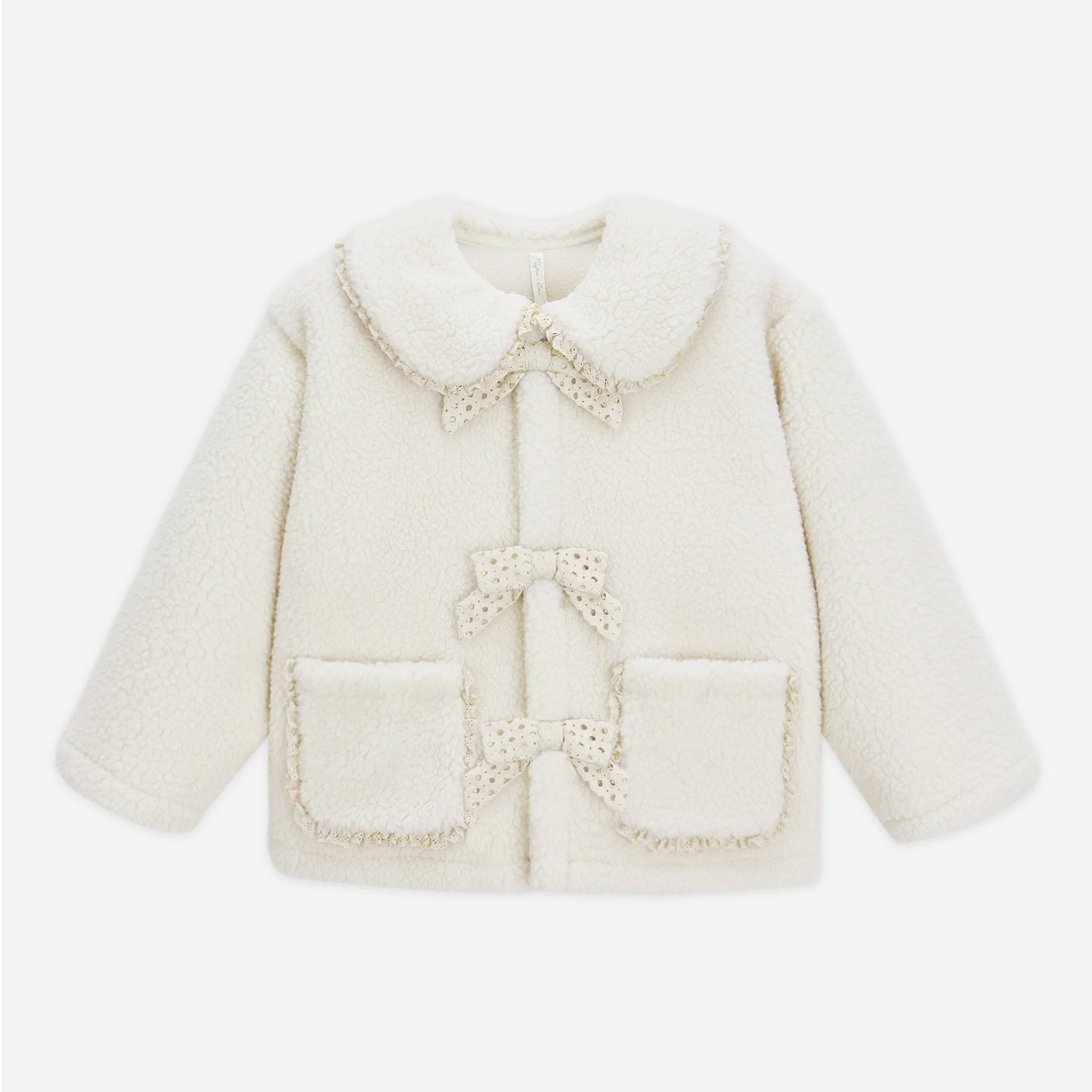 An ivory shearling coat with an ivory lacey lined edge and tie closure detail.