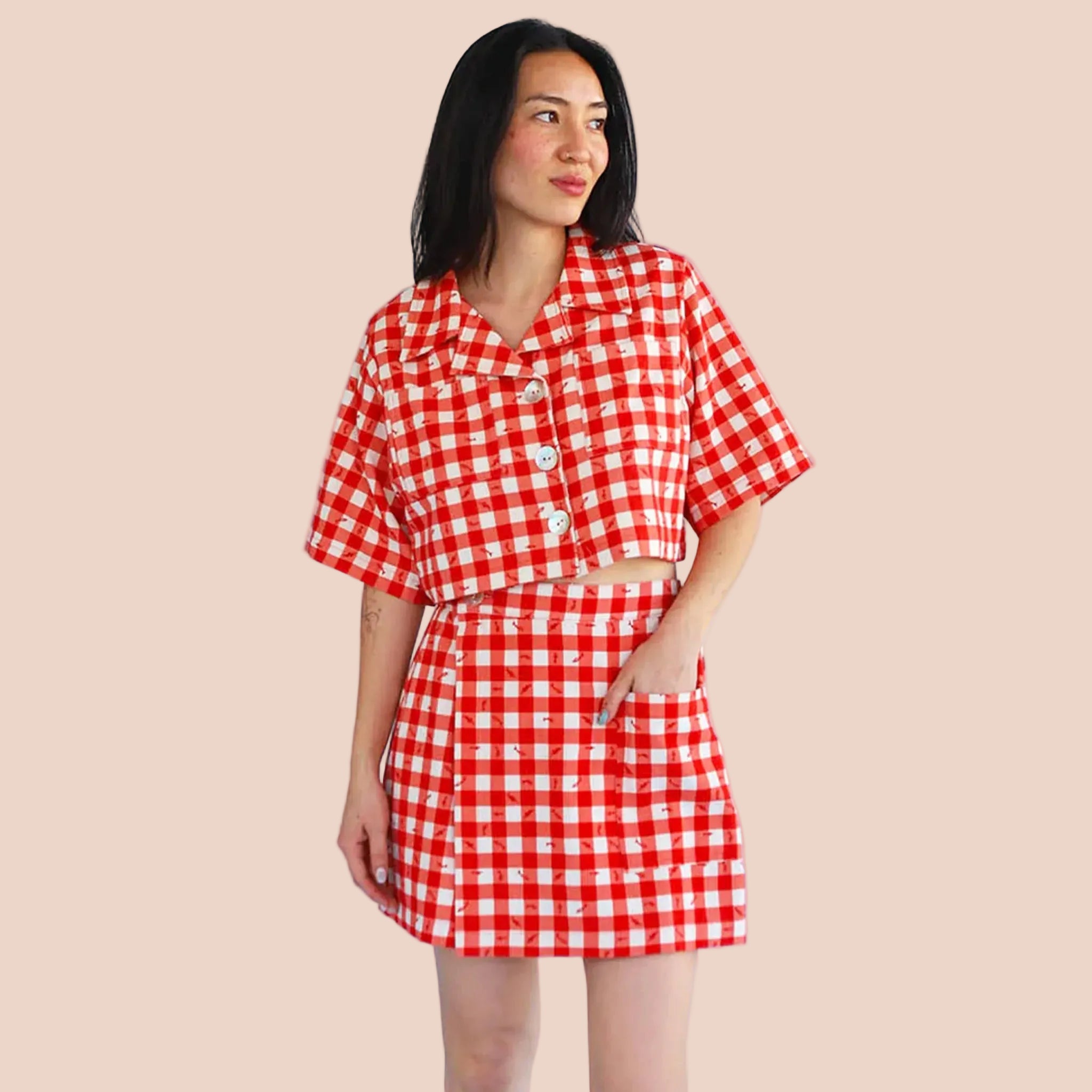 A red gingham print and fish pattern skort. 