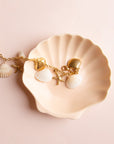 A shell and starfish charm bracelet. 