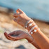 A set of hair ties with shells and coastal beads that also double as cute bracelets when you aren't wearing them in your hair. 