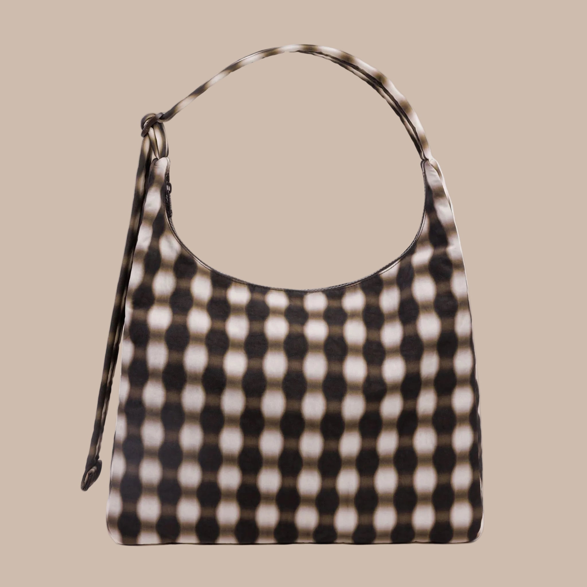 A brown and black blurred gingham print shoulder bag. 