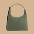 A green nylon shoulder bag.