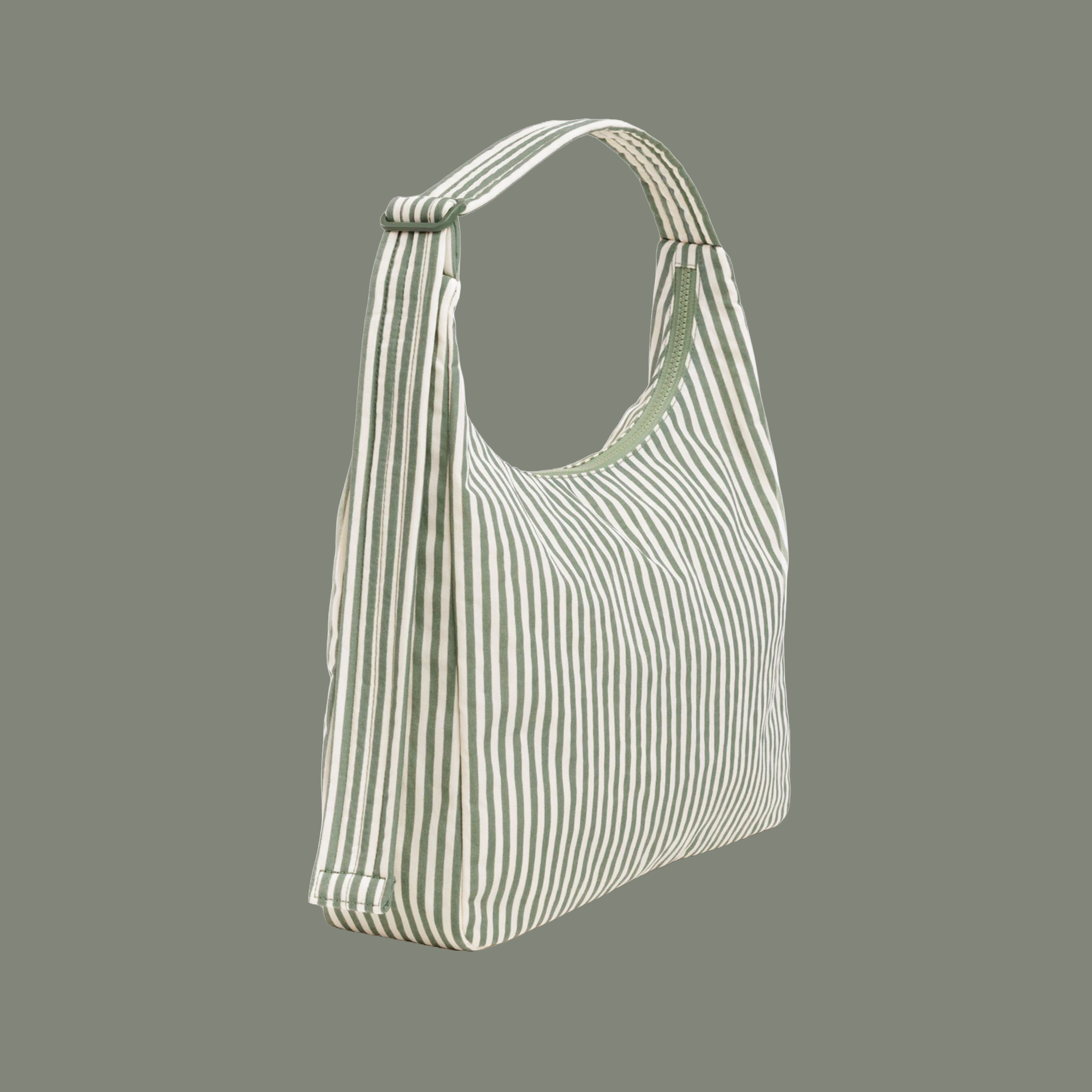 A sage striped nylon shoulder bag on a sage colored ground. 