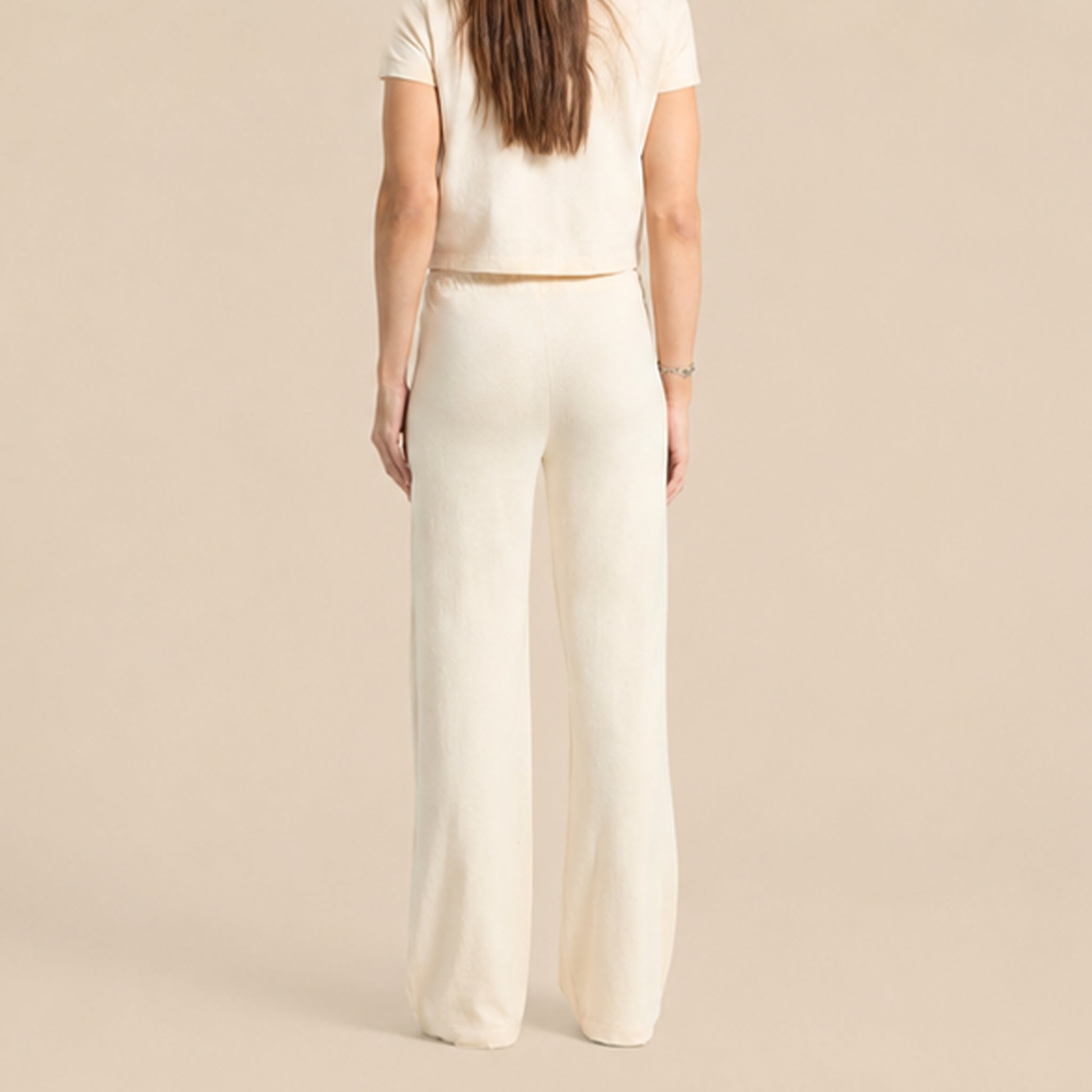 A pair of white knit pants. 
