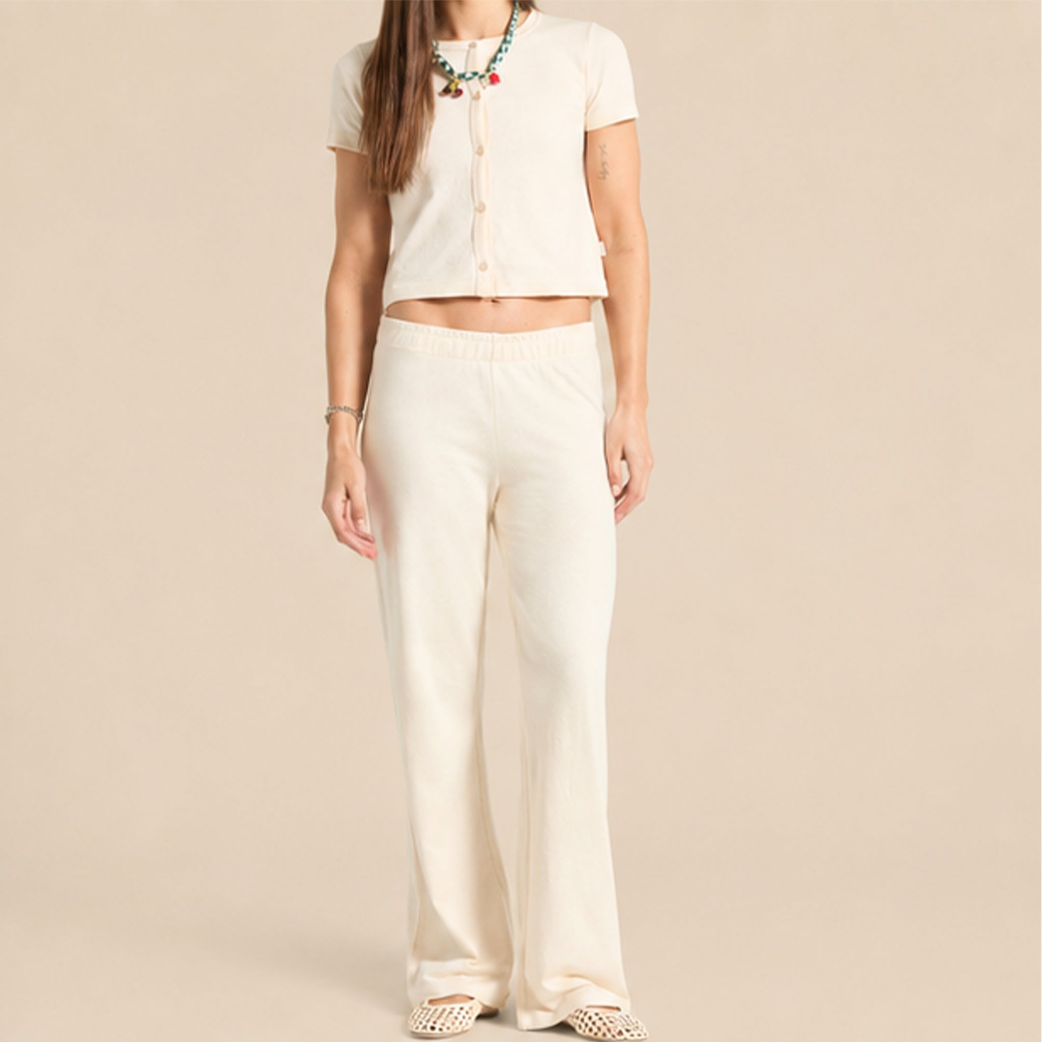 A pair of white knit pants. 