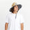 A straw sun hat with a dark blue and white desert design under the brim and a coordinating neck strap. 