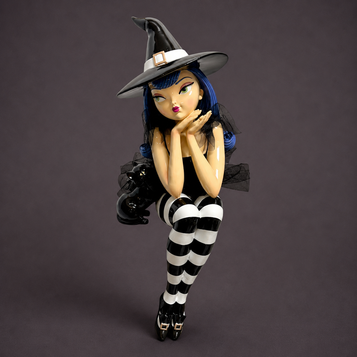 A purple haired witch sitting decor. 