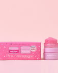 A pink box filled with a lip scrub and lip mask in a pink champagne scent. 