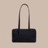 A black thin shoulder bag with a shoulder strap and thin body. 