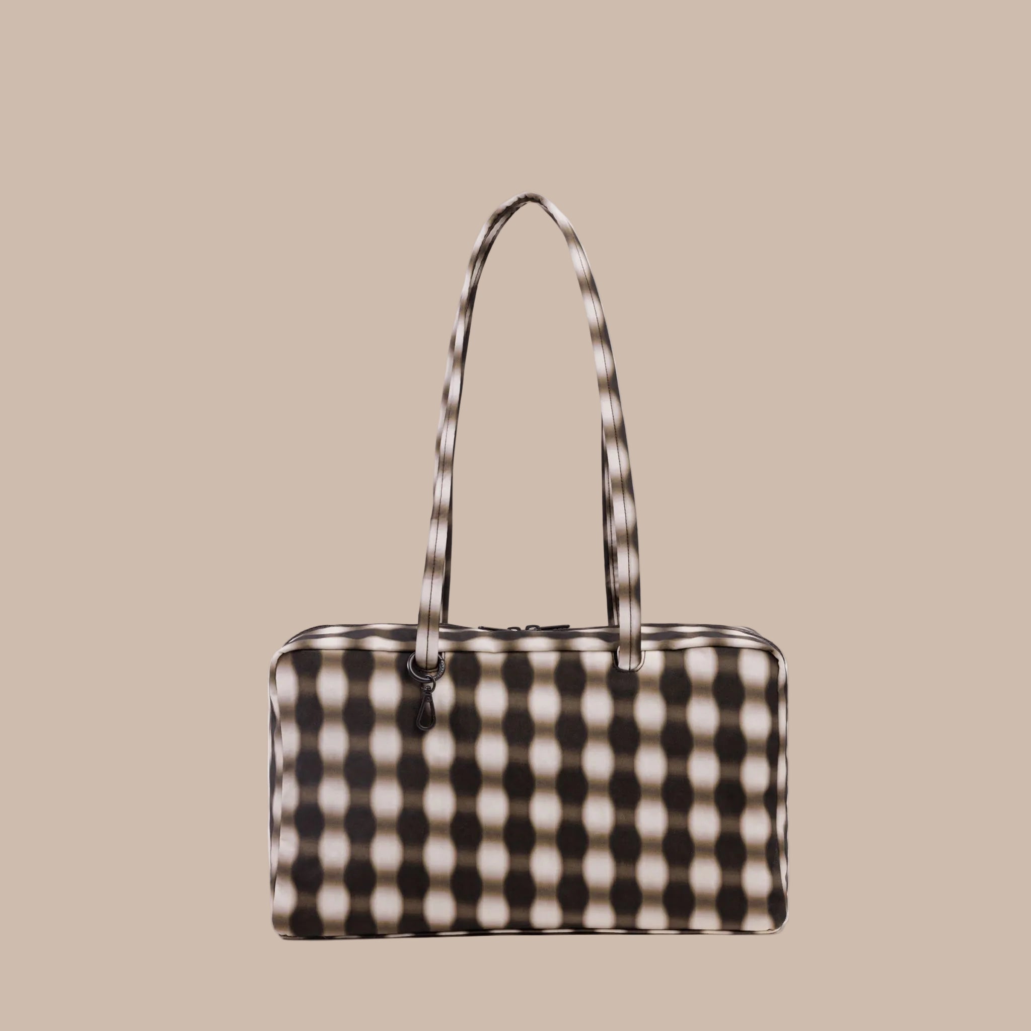 A brown and tan blurred gingham print rectangle handbag. 