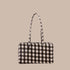 A brown and tan blurred gingham print rectangle handbag.
