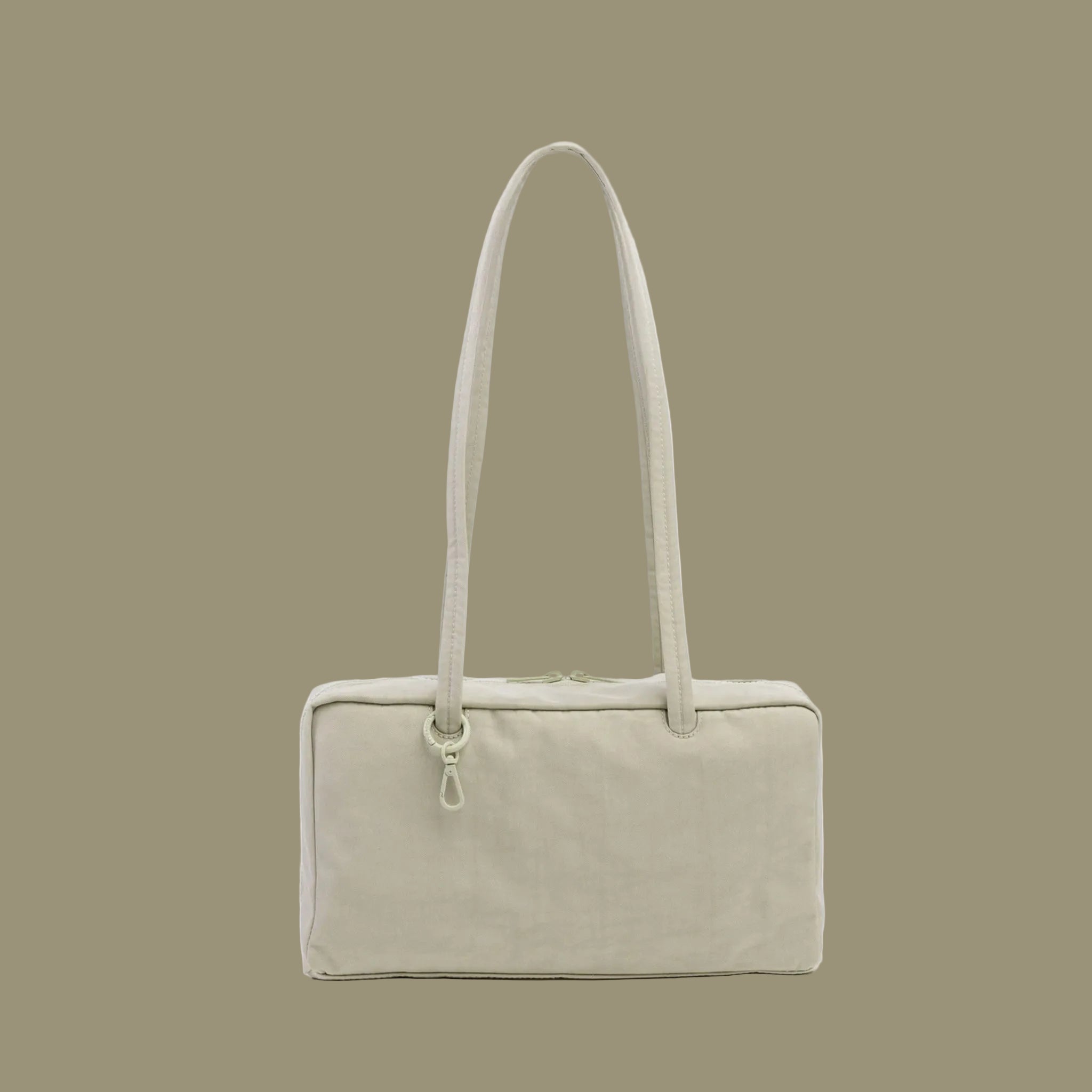 A super pale green nylon rectangle shaped shoulder bag. 