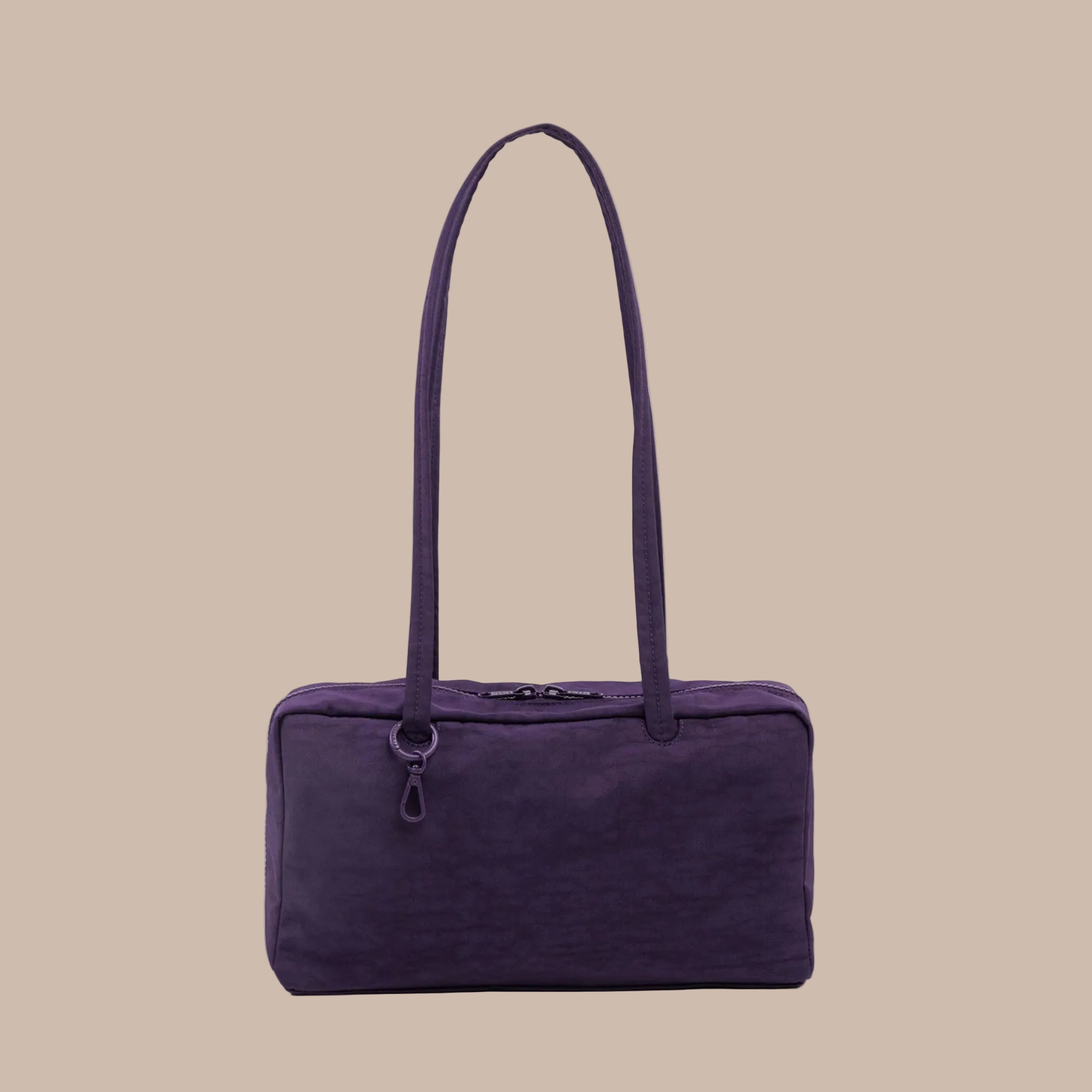 A dark purple nylon rectangle shoulder bag. 