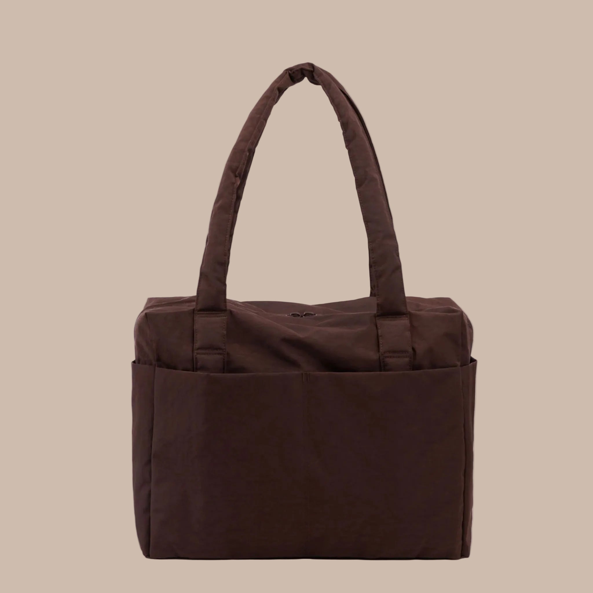 A dark brown nylon carry on tote bag. 