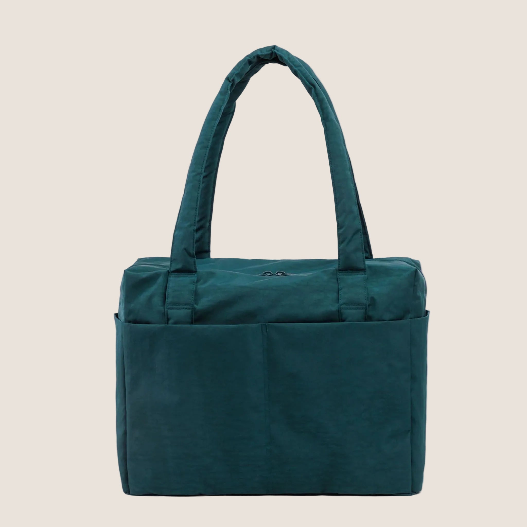 A dark teal colored carry on tote bag. 