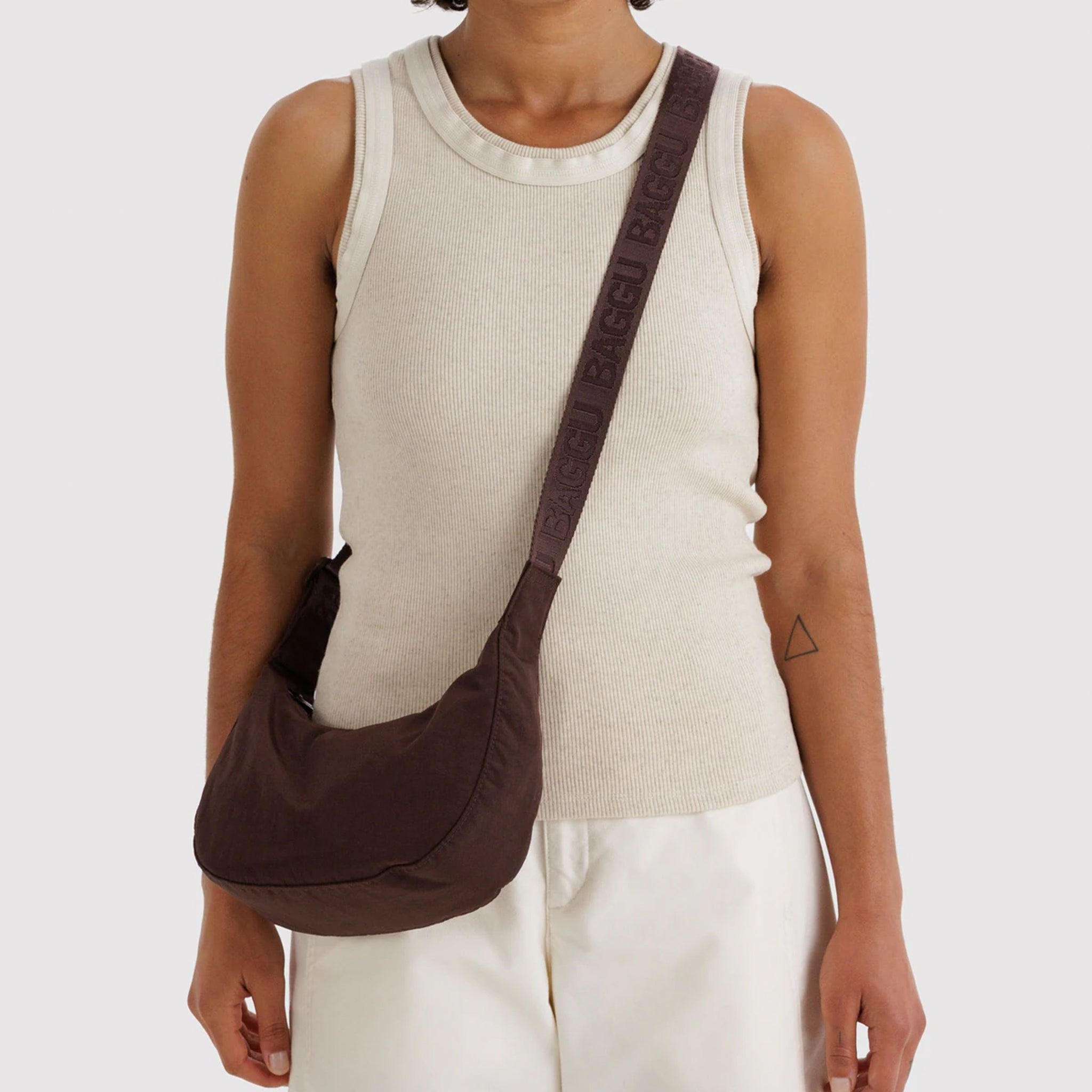 A small brown nylon crescent shaped bag. 