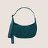 a dark teal colored nylon crescent shaped handbag. 