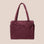 A puffy nylon carry on bag in a mahogany color. 