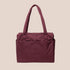 A puffy nylon carry on bag in a mahogany color. 
