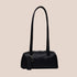 A recycled black leather handbag with shoulder straps. 