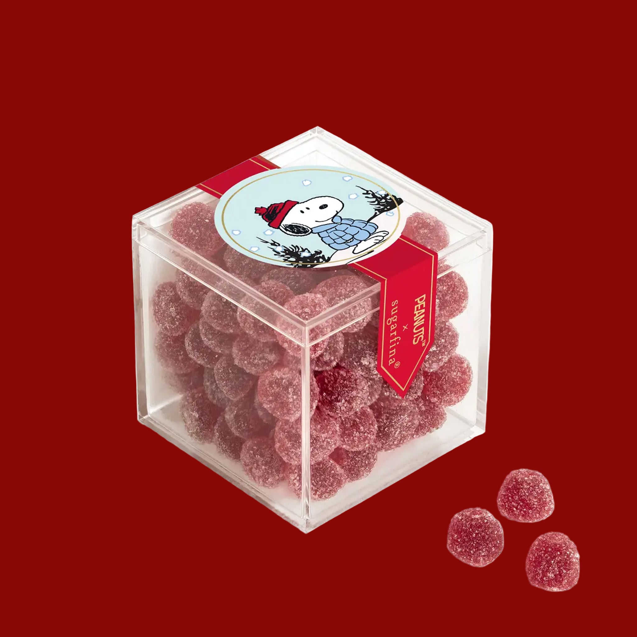 An acrylic box of sugared gummy candies. 